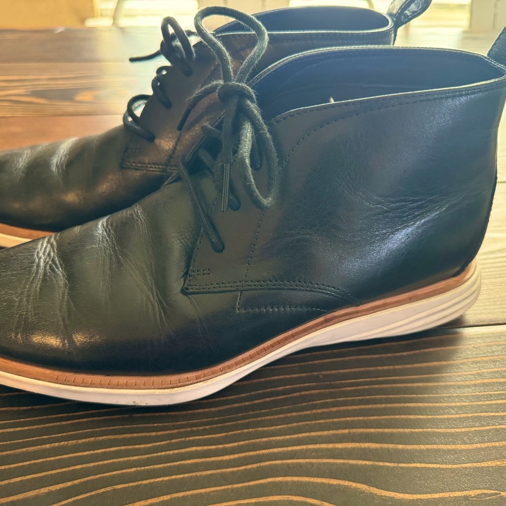 Men’s Black Cole Haan boots.